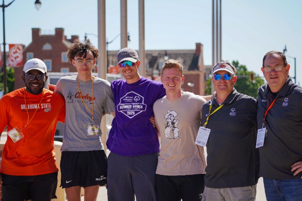 Six Special Olympics volunteers posing for photo.